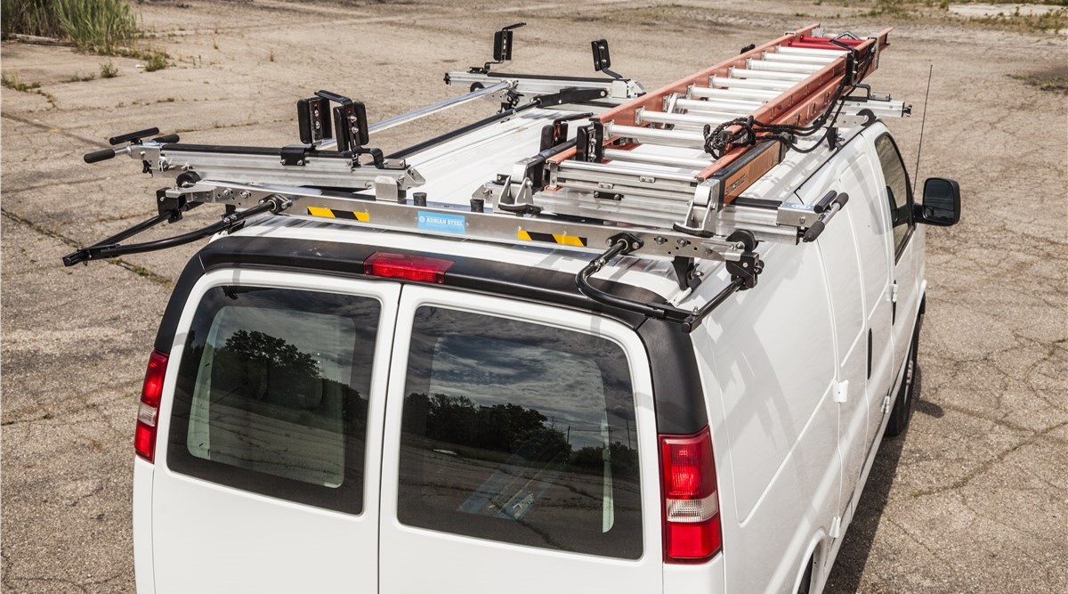 Ladder rack with a ladder on it in a white van
