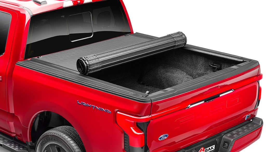 Red pick up truck with roll up bed cover
